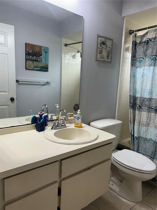 13316 Brigham Ln, Hudson, FL 34667 - full bath featuring vanity, tile patterned flooring, toilet, and shower / bath combo with shower curtain