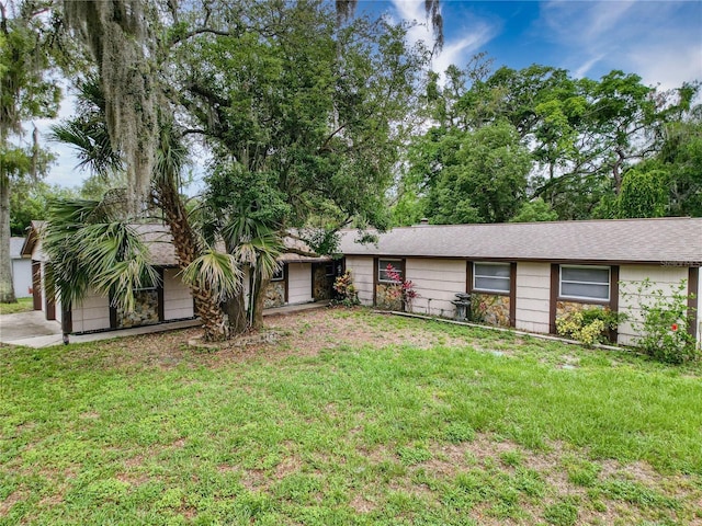 7119 Lenape Cir, New Port Richey, FL 34653 - view of front of home with a front yard