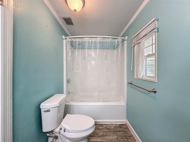 7119 Lenape Cir, New Port Richey, FL 34653 - full bathroom with toilet, ornamental molding, wood finished floors, shower / bath combo with shower curtain, and baseboards