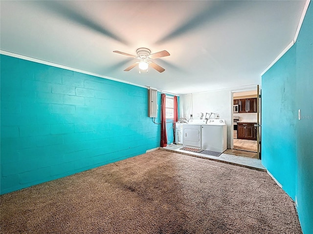 7119 Lenape Cir, New Port Richey, FL 34653 - carpeted empty room featuring washing machine and dryer, a ceiling fan, electric panel, and concrete block wall