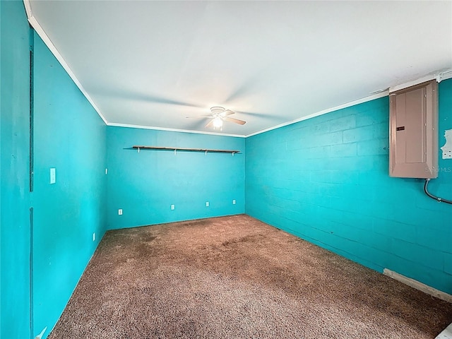 7119 Lenape Cir, New Port Richey, FL 34653 - spare room featuring electric panel, ceiling fan, carpet flooring, and crown molding