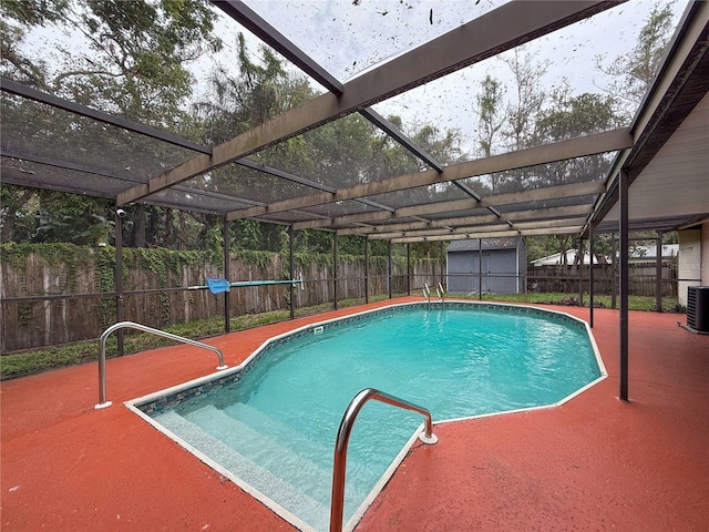 7119 Lenape Cir, New Port Richey, FL 34653 - view of swimming pool with a fenced backyard, a patio, and a lanai