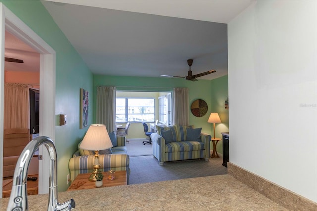 5123 Topaz Ln Unit 206, New Port Richey, FL 34652 - carpeted living room featuring a ceiling fan and baseboards
