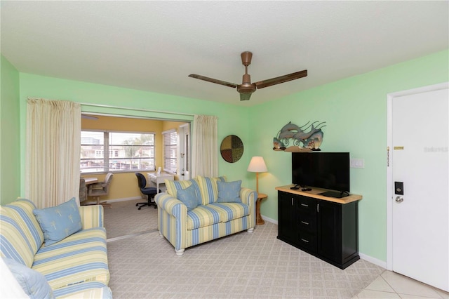 5123 Topaz Ln Unit 206, New Port Richey, FL 34652 - living area featuring a ceiling fan, baseboards, light carpet, and a desk