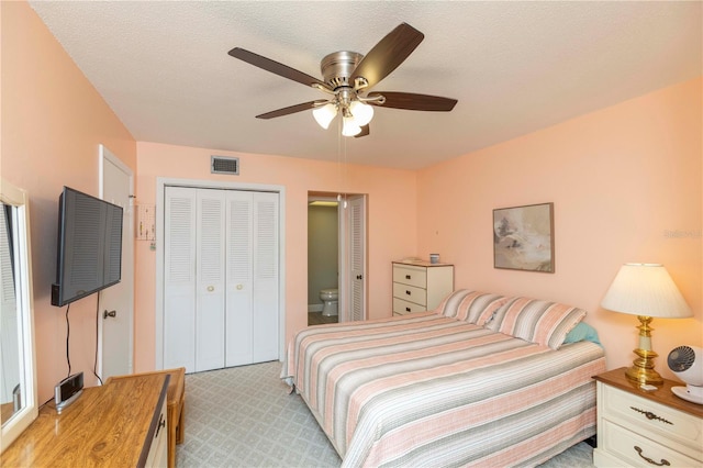 5123 Topaz Ln Unit 206, New Port Richey, FL 34652 - bedroom featuring light colored carpet, a ceiling fan, and a closet