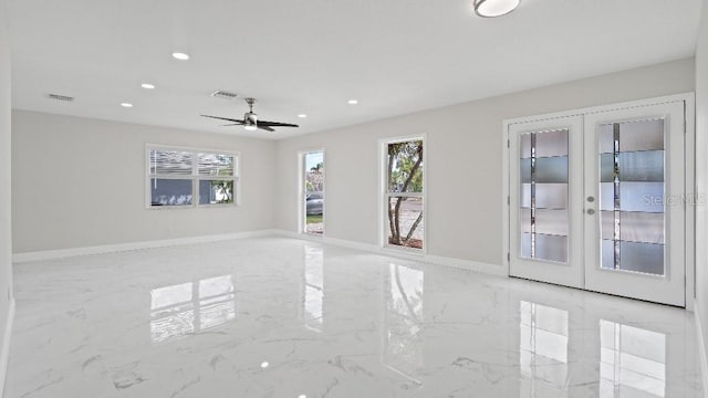 1024 Spindle Palm Way, Apollo Beach, FL 33572 - spare room with light marble finish floors, french doors, recessed lighting, ceiling fan, and baseboards