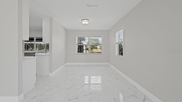 1024 Spindle Palm Way, Apollo Beach, FL 33572 - unfurnished room featuring light marble finish floors and baseboards