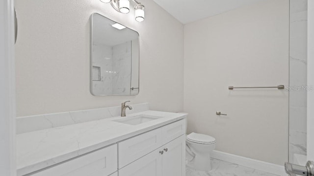 1024 Spindle Palm Way, Apollo Beach, FL 33572 - bathroom featuring marble finish floors, vanity, toilet, baseboards, and a marble finish shower