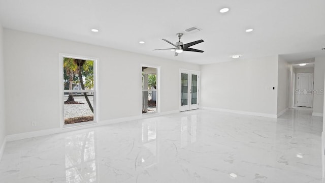 1024 Spindle Palm Way, Apollo Beach, FL 33572 - empty room featuring light marble finish flooring, recessed lighting, a ceiling fan, baseboards, and french doors
