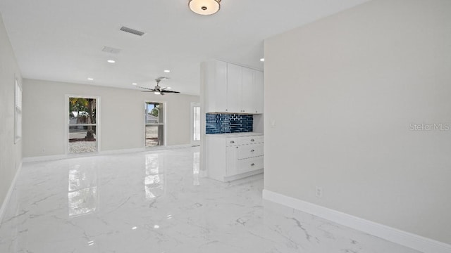 1024 Spindle Palm Way, Apollo Beach, FL 33572 - unfurnished living room with light marble finish flooring, baseboards, ceiling fan, and recessed lighting