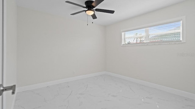 1024 Spindle Palm Way, Apollo Beach, FL 33572 - unfurnished room featuring marble look tiles, baseboards, and ceiling fan