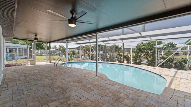1024 Spindle Palm Way, Apollo Beach, FL 33572 - swimming pool featuring a patio area, a ceiling fan, and glass enclosure