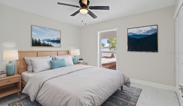 1024 Spindle Palm Way, Apollo Beach, FL 33572 - bedroom with marble finish flooring, a ceiling fan, and baseboards