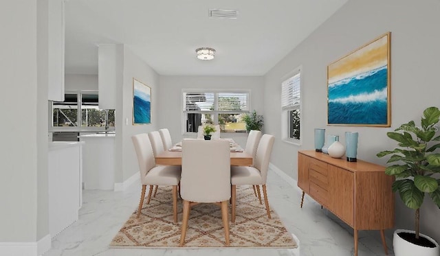 1024 Spindle Palm Way, Apollo Beach, FL 33572 - dining area with light marble finish floors and baseboards