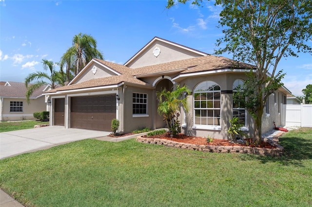 1862 Wood Bend St, Tarpon Springs, FL 34689 - single story home featuring stucco siding, a garage, concrete driveway, and a shingled roof