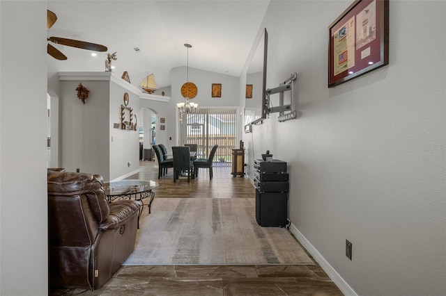 1862 Wood Bend St, Tarpon Springs, FL 34689 - hallway featuring a chandelier, vaulted ceiling, arched walkways, and baseboards