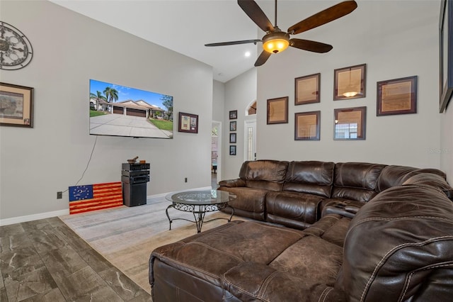 1862 Wood Bend St, Tarpon Springs, FL 34689 - living area with ceiling fan, a towering ceiling, and baseboards