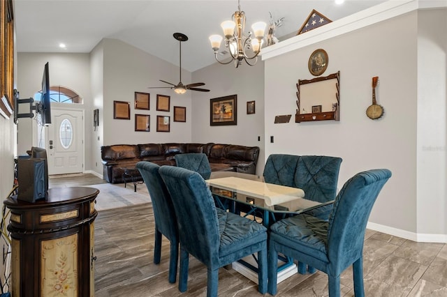 1862 Wood Bend St, Tarpon Springs, FL 34689 - dining room featuring a chandelier, baseboards, a ceiling fan, high vaulted ceiling, and recessed lighting