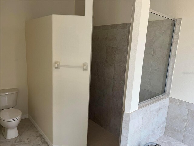 11520 Lounds Ct, New Port Richey, FL 34654 - bathroom featuring walk in shower, toilet, tile patterned floors, and a garden tub