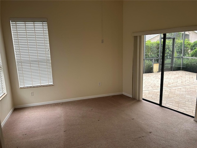 11520 Lounds Ct, New Port Richey, FL 34654 - carpeted empty room with baseboards