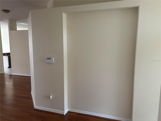 11520 Lounds Ct, New Port Richey, FL 34654 - hall featuring baseboards and dark wood finished floors
