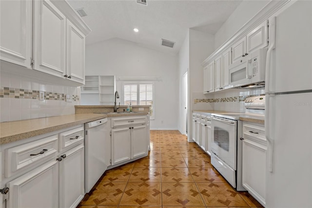 4125 Mc Clung Dr, New Port Richey, FL 34653 - kitchen featuring white appliances, a sink, backsplash, white cabinets, and vaulted ceiling