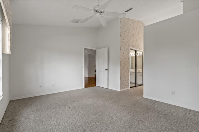 4125 Mc Clung Dr, New Port Richey, FL 34653 - spare room featuring carpet floors, ceiling fan, baseboards, and high vaulted ceiling