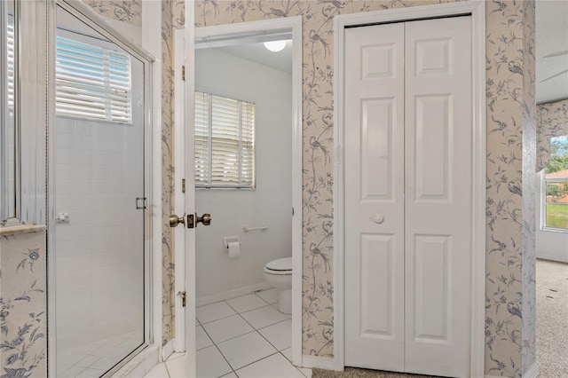 4125 Mc Clung Dr, New Port Richey, FL 34653 - full bath featuring a closet, a shower stall, toilet, tile patterned floors, and wallpapered walls