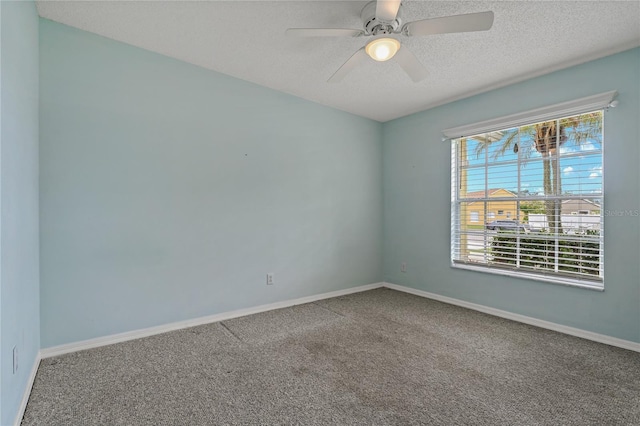 4125 Mc Clung Dr, New Port Richey, FL 34653 - empty room featuring carpet flooring, a textured ceiling, baseboards, and a ceiling fan