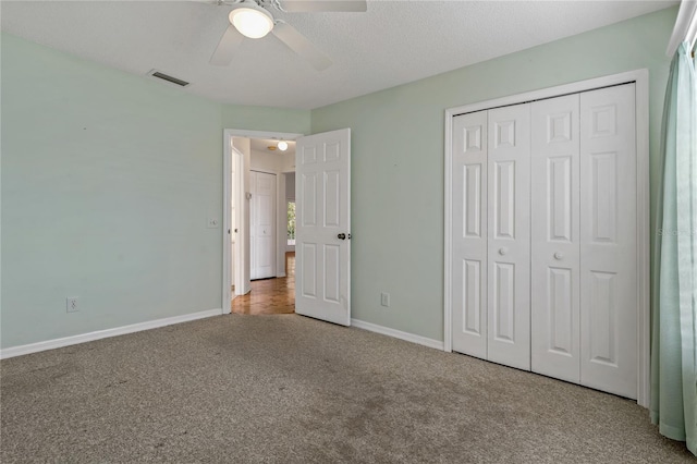 4125 Mc Clung Dr, New Port Richey, FL 34653 - unfurnished bedroom with carpet floors, baseboards, a closet, and a ceiling fan