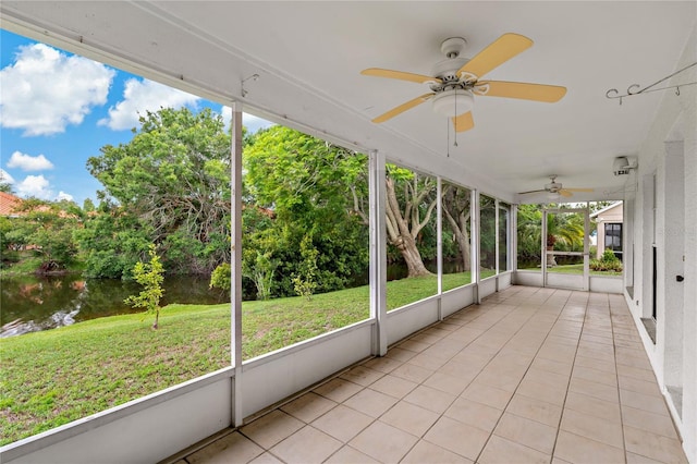4125 Mc Clung Dr, New Port Richey, FL 34653 - unfurnished sunroom featuring ceiling fan, view of wooded area, and healthy amount of natural light
