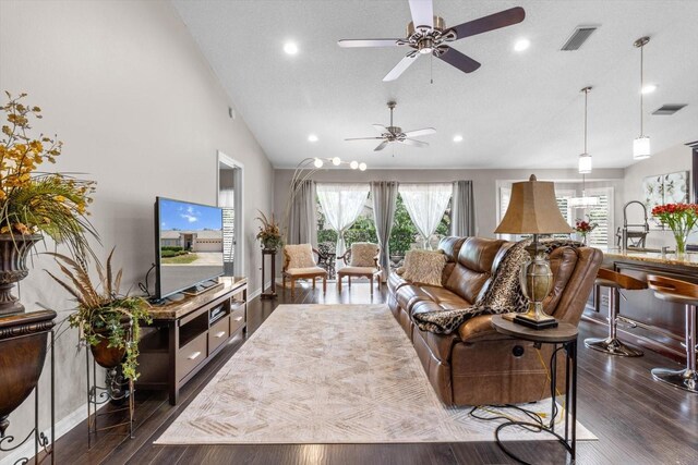 1142 Wolford Dr, Trinity, FL 34655 - living room with ceiling fan, vaulted ceiling, dark wood-style flooring, recessed lighting, and baseboards