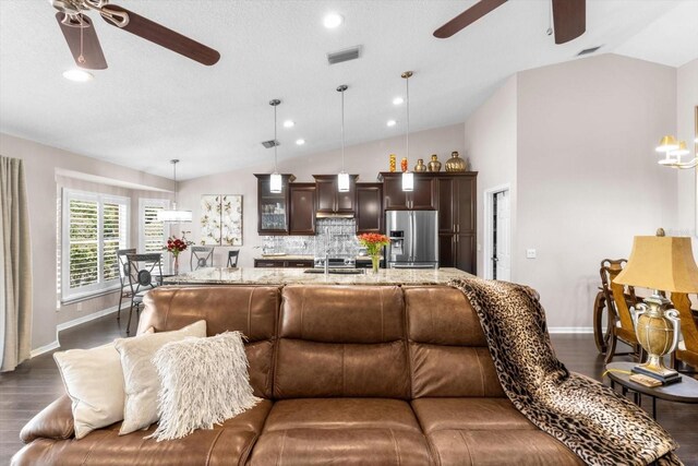1142 Wolford Dr, Trinity, FL 34655 - living area featuring ceiling fan, lofted ceiling, dark wood-type flooring, baseboards, and recessed lighting