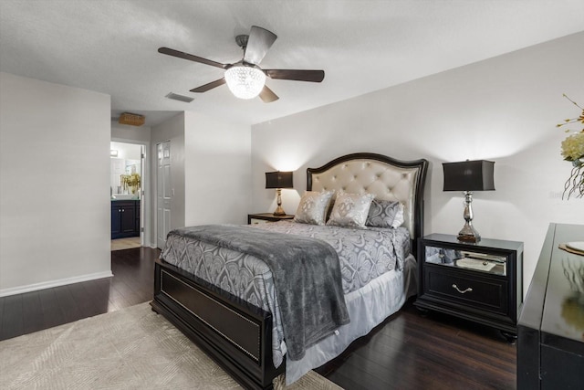 1142 Wolford Dr, Trinity, FL 34655 - bedroom featuring wood finished floors, baseboards, ceiling fan, and ensuite bath