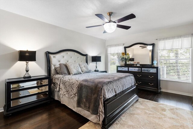 1142 Wolford Dr, Trinity, FL 34655 - bedroom with wood finished floors, baseboards, and ceiling fan