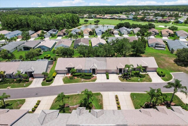 1142 Wolford Dr, Trinity, FL 34655 - aerial perspective of suburban area with a nearby body of water