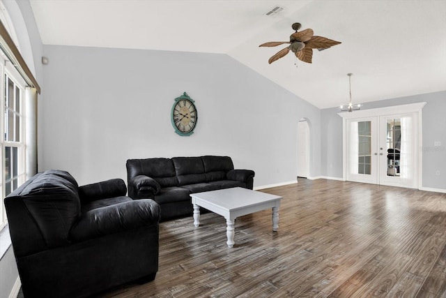 2172 Whitewood Ave, Spring Hill, FL 34609 - living area with lofted ceiling, french doors, dark wood-style flooring, ceiling fan, and a chandelier