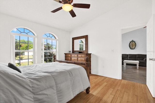 2172 Whitewood Ave, Spring Hill, FL 34609 - bedroom with light wood-type flooring, a ceiling fan, and high vaulted ceiling