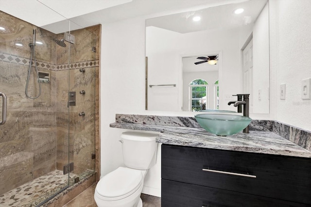 2172 Whitewood Ave, Spring Hill, FL 34609 - full bath featuring vanity, toilet, a shower stall, and a ceiling fan
