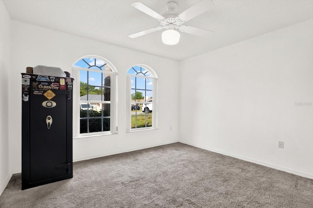 2172 Whitewood Ave, Spring Hill, FL 34609 - spare room featuring carpet floors, baseboards, and a ceiling fan