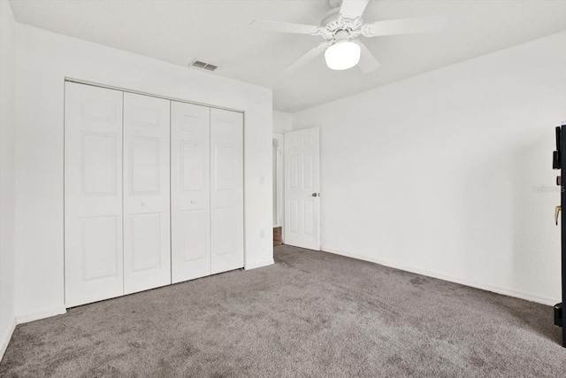2172 Whitewood Ave, Spring Hill, FL 34609 - unfurnished bedroom featuring carpet, a closet, a ceiling fan, and baseboards