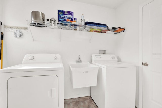 2172 Whitewood Ave, Spring Hill, FL 34609 - laundry area with washing machine and clothes dryer and light tile patterned flooring