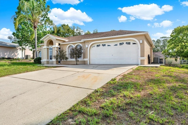 2172 Whitewood Ave, Spring Hill, FL 34609 - view of front of property featuring stucco siding, an attached garage, concrete driveway, and a front lawn