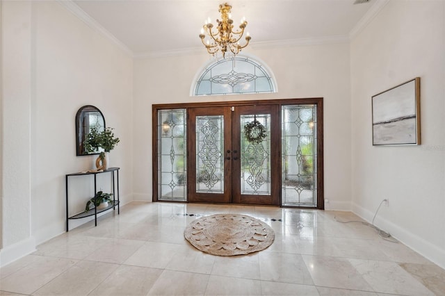 1471 N Jasmine Ave, Tarpon Springs, FL 34689 - entryway featuring a chandelier, crown molding, baseboards, and french doors