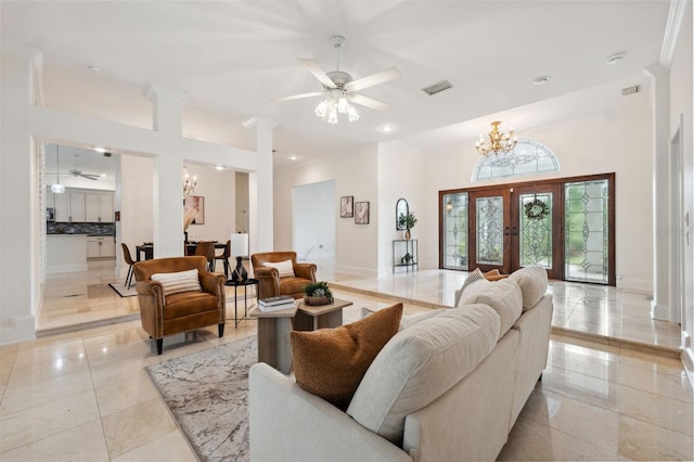 1471 N Jasmine Ave, Tarpon Springs, FL 34689 - living area featuring a chandelier, ceiling fan, ornamental molding, baseboards, and a towering ceiling