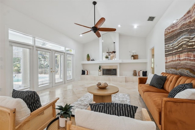 1471 N Jasmine Ave, Tarpon Springs, FL 34689 - living area with french doors, high vaulted ceiling, built in shelves, ceiling fan, and a tiled fireplace