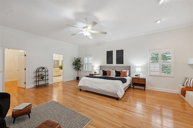 1471 N Jasmine Ave, Tarpon Springs, FL 34689 - bedroom featuring ornamental molding, light wood-style floors, baseboards, ceiling fan, and ensuite bathroom