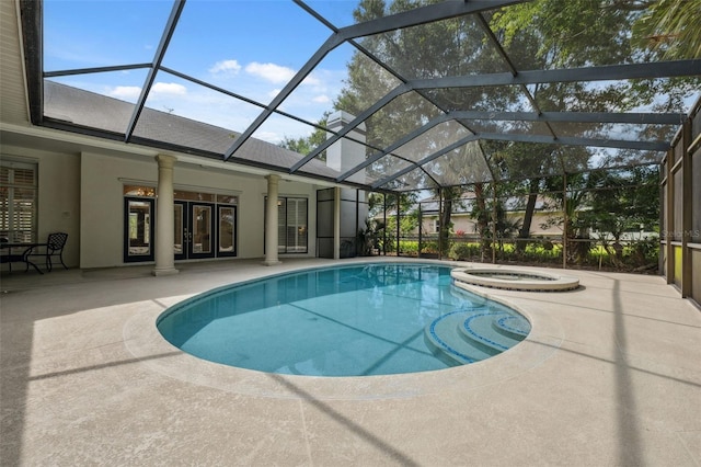1471 N Jasmine Ave, Tarpon Springs, FL 34689 - view of swimming pool with a patio area, a pool with connected hot tub, french doors, and glass enclosure