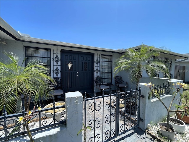7534 Briarwood Dr, Port Richey, FL 34668 - doorway to property with a gate