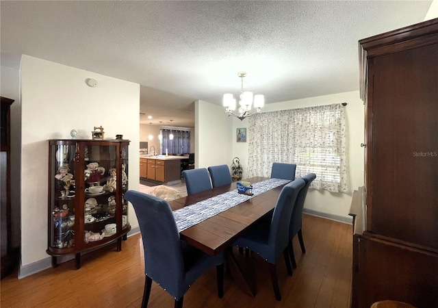 7534 Briarwood Dr, Port Richey, FL 34668 - dining space with a chandelier, light wood-style flooring, and baseboards